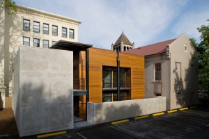 The new addition rests easily between the historic structures.